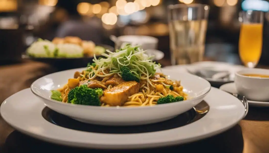 A bowl of noodles and fresh vegetables served on a table, showcasing a delightful dish from Bishan, Singapore's best food spots.