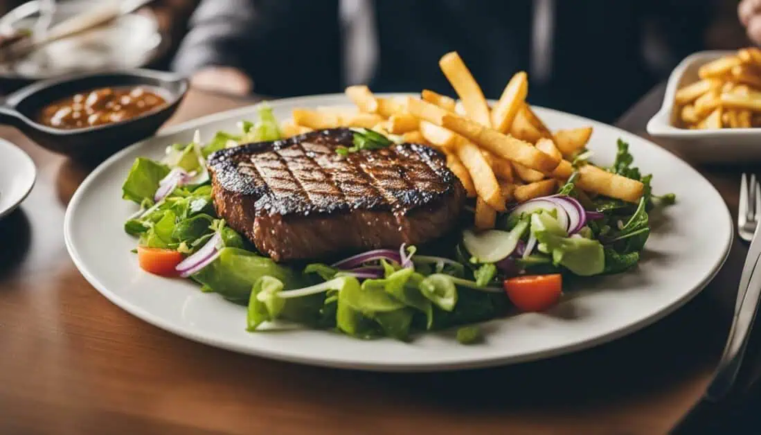 A delicious steak accompanied by crispy French fries on a plate, showcasing the best Halal Western food in Singapore.