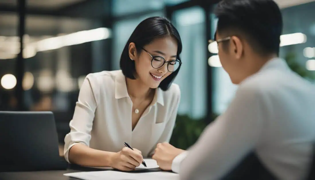 A man and a woman are at a table, diligently taking notes as they explore personal loan options in Singapore.
