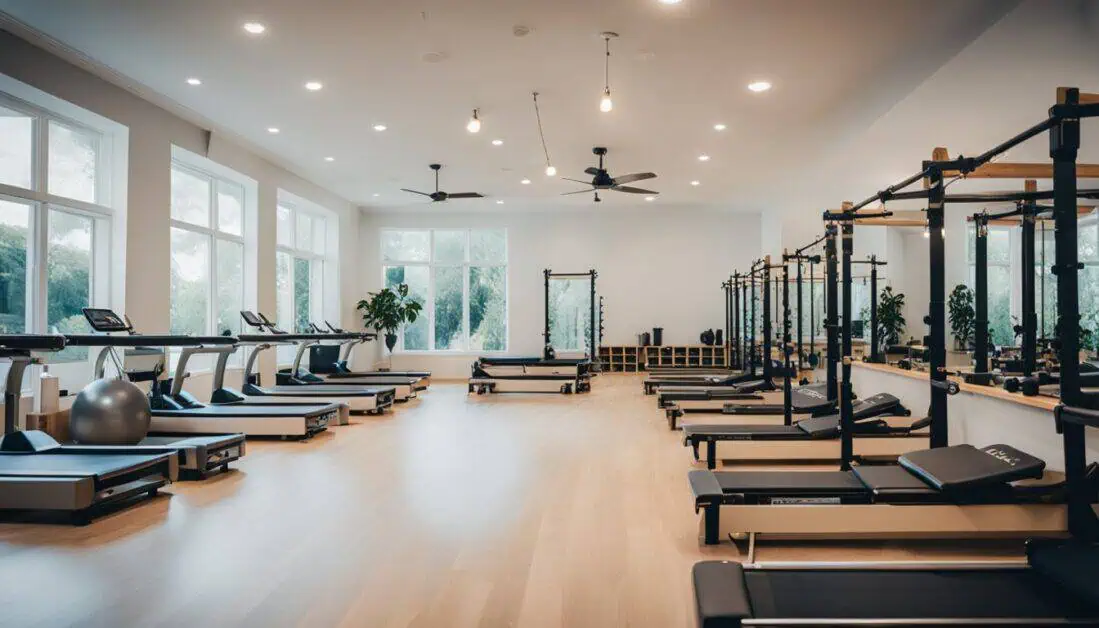 A well-equipped gym featuring numerous pilates machines and treadmills, showcasing the best Pilates studios in Singapore.